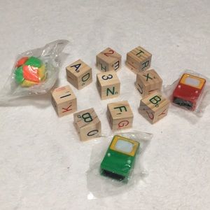 Wooden blocks and individually wrapped plastic toys and game